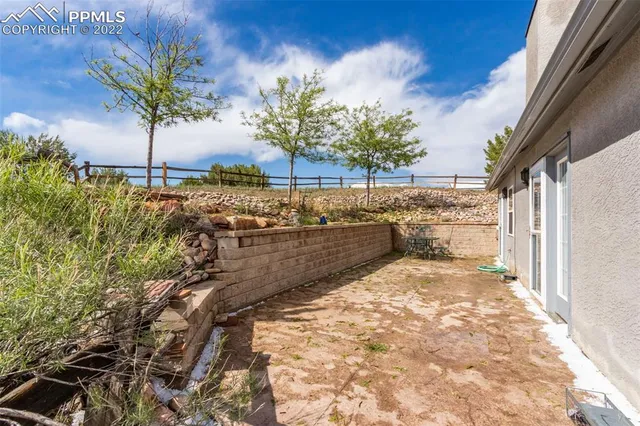 a view of a backyard of a house