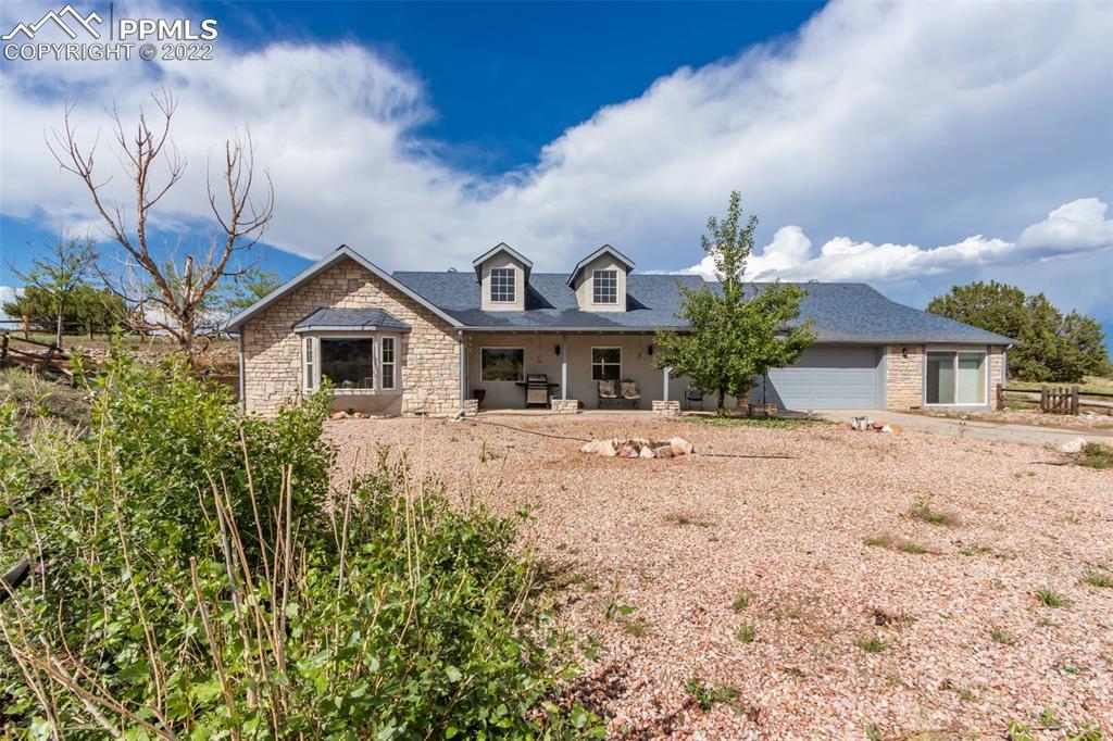 6670 Zercher Road Beulah, CO 81023 - Photo 5 of 41 a front view of a house with garden