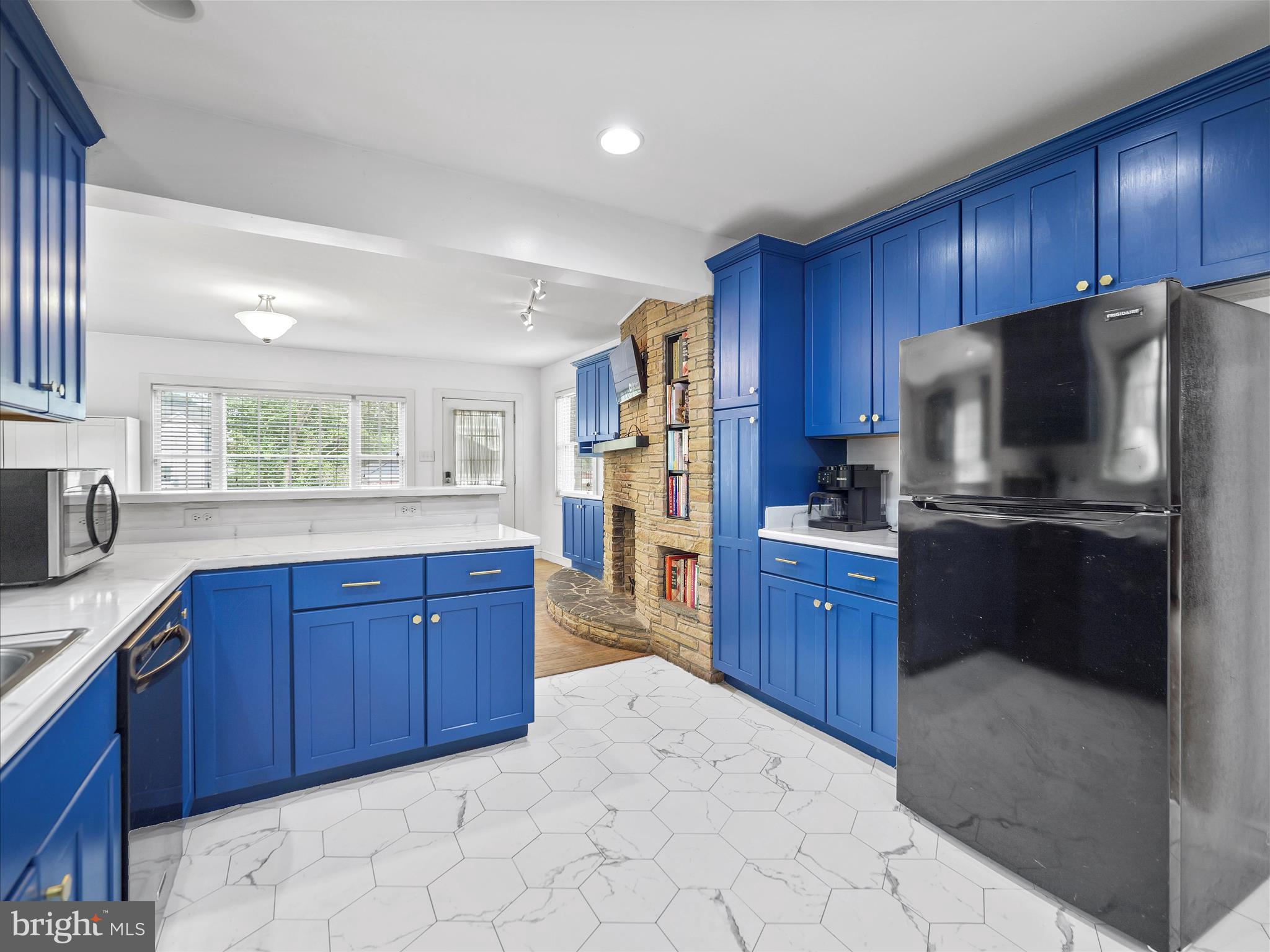 223 East 3rd Street Waynesboro, PA 17268 - Photo 15 of 42 a kitchen with stainless steel appliances granite countertop a refrigerator sink and cabinets