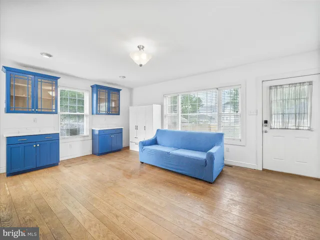 a living room with furniture and windows