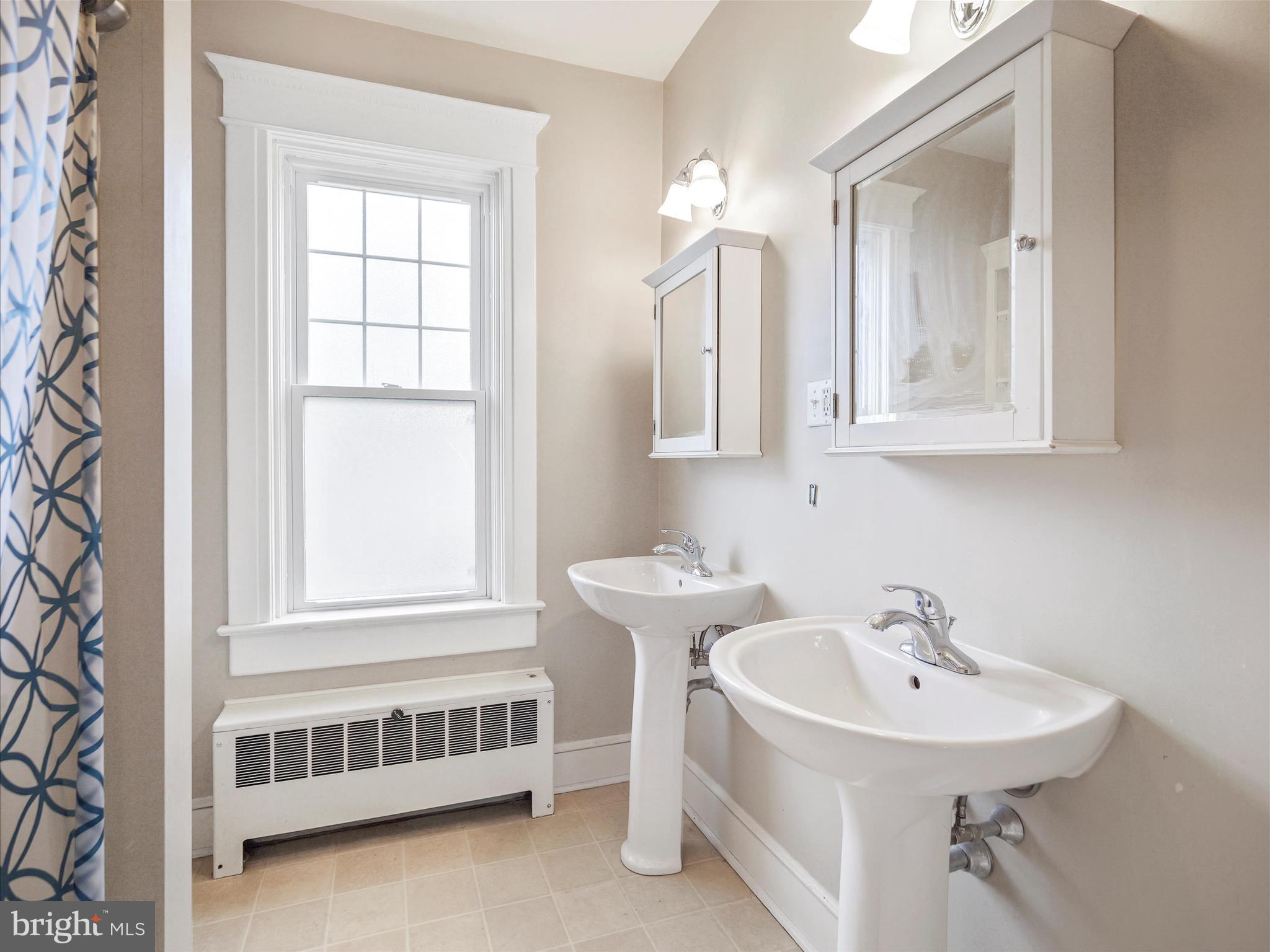 223 East 3rd Street Waynesboro, PA 17268 - Photo 24 of 42 a bathroom with a sink and a mirror