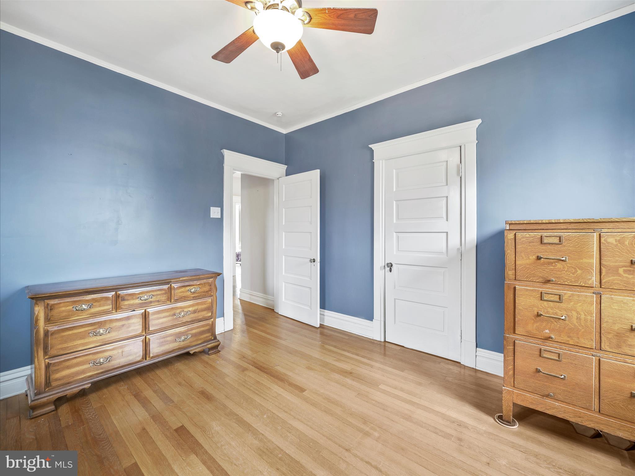 223 East 3rd Street Waynesboro, PA 17268 - Photo 26 of 42 an empty room with wooden floor closet and windows