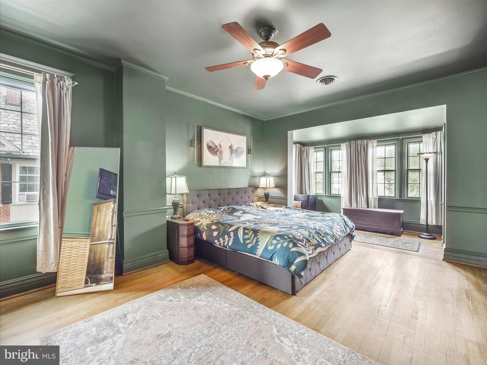 223 East 3rd Street Waynesboro, PA 17268 - Photo 27 of 42 a bedroom with a large bed and a chandelier