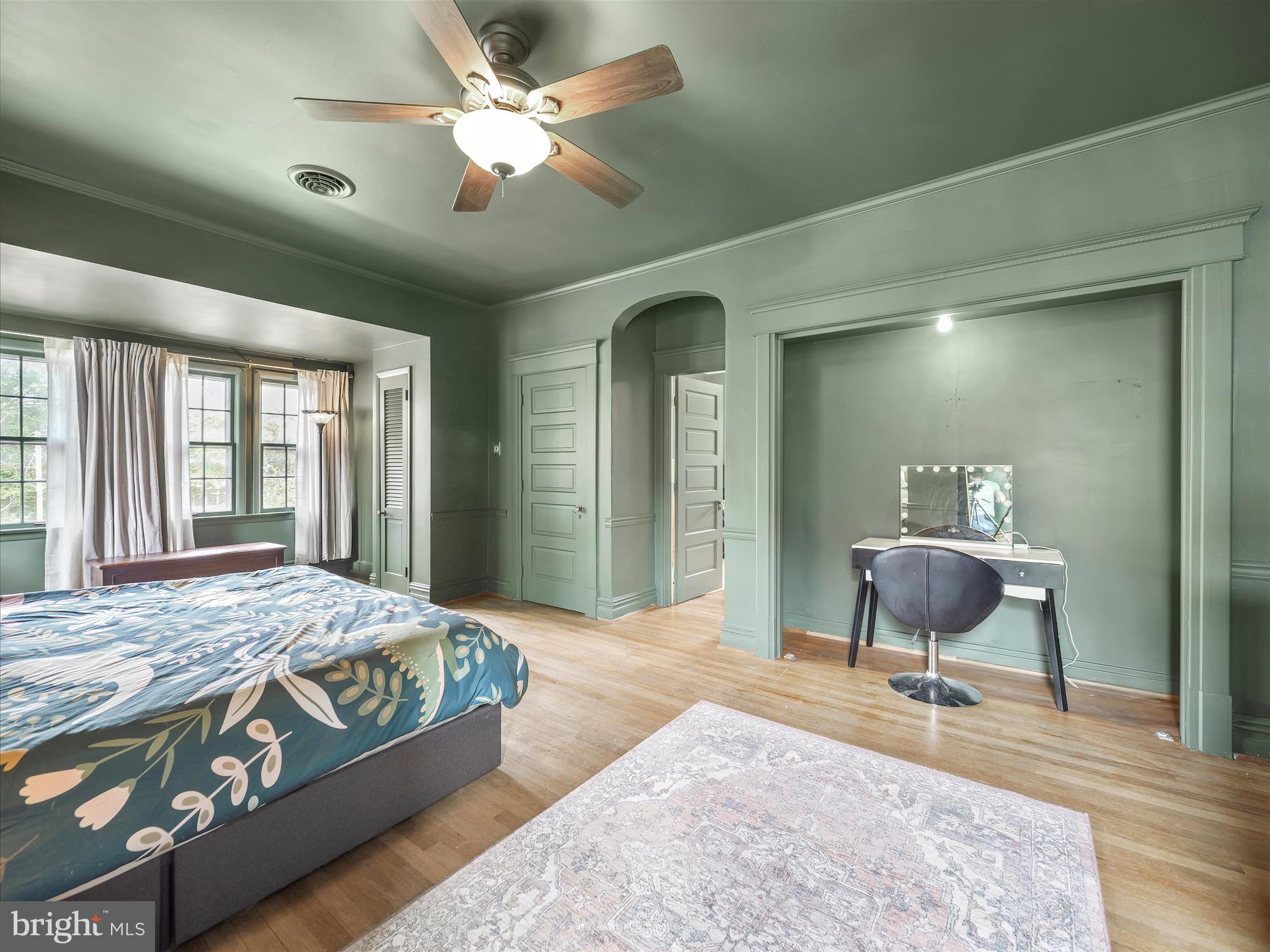 223 East 3rd Street Waynesboro, PA 17268 - Photo 29 of 42 a bedroom with a bed and a chandelier