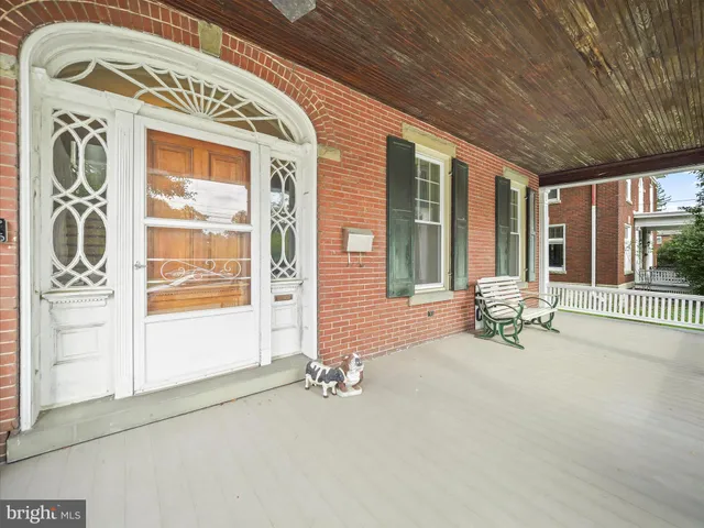 a view of an entrance to house with yard