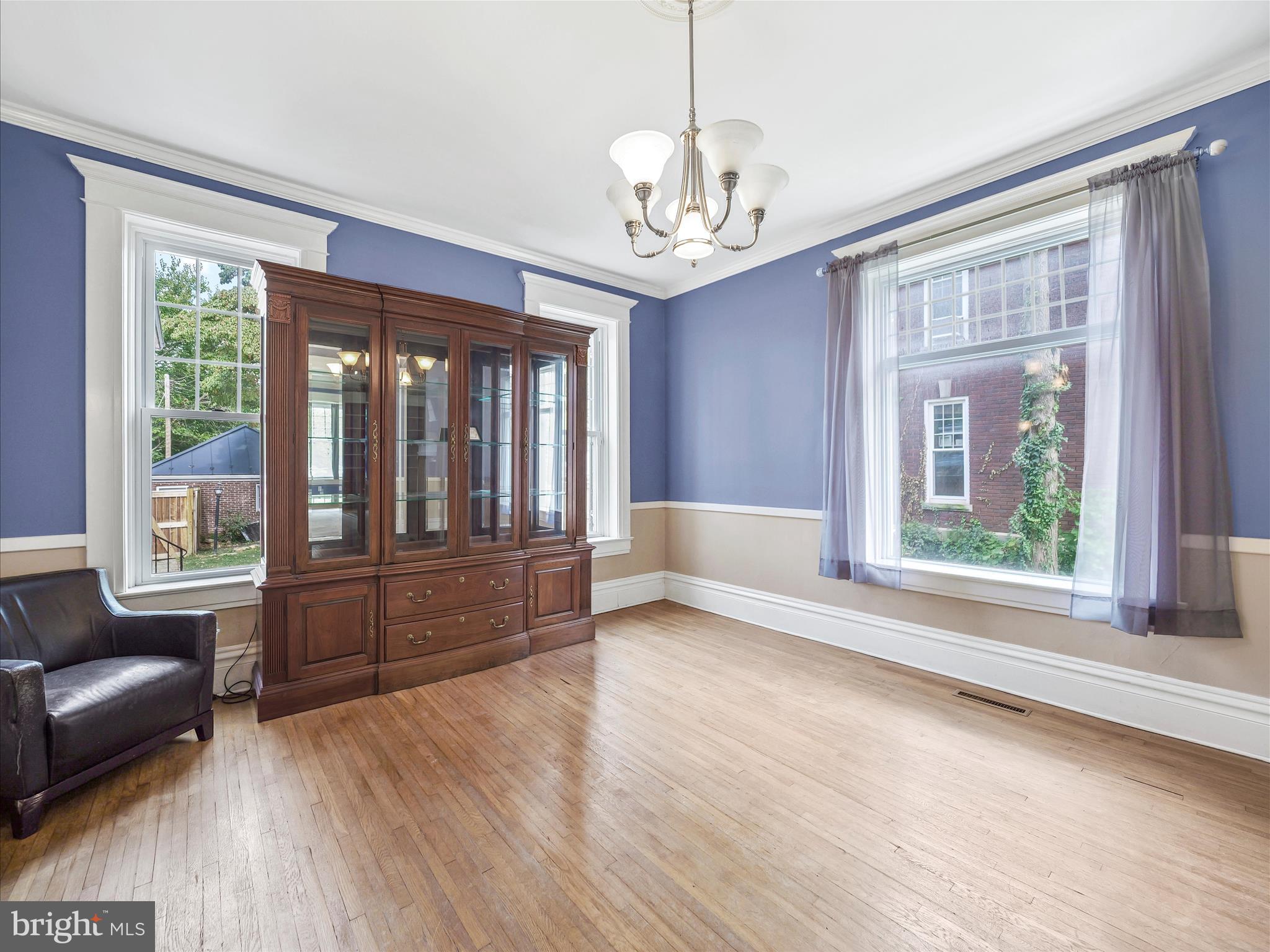 223 East 3rd Street Waynesboro, PA 17268 - Photo 10 of 42 a view of livingroom with furniture wooden floor chandelier and windows