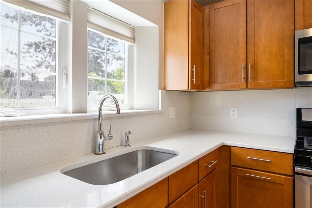 6 Bates Street, Unit A Devens, MA 01434 - Photo 20 of 41 a kitchen with a sink and a window