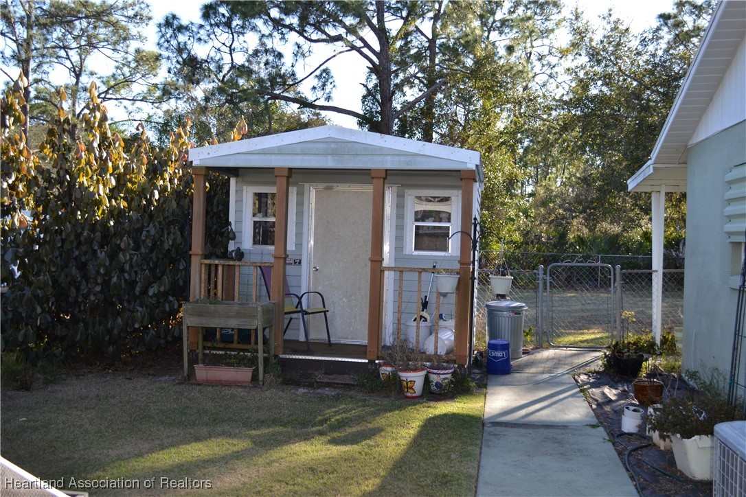 3913 Ferrari Drive Sebring, FL 33872 - Photo 3 of 20 a front view of a house with garden