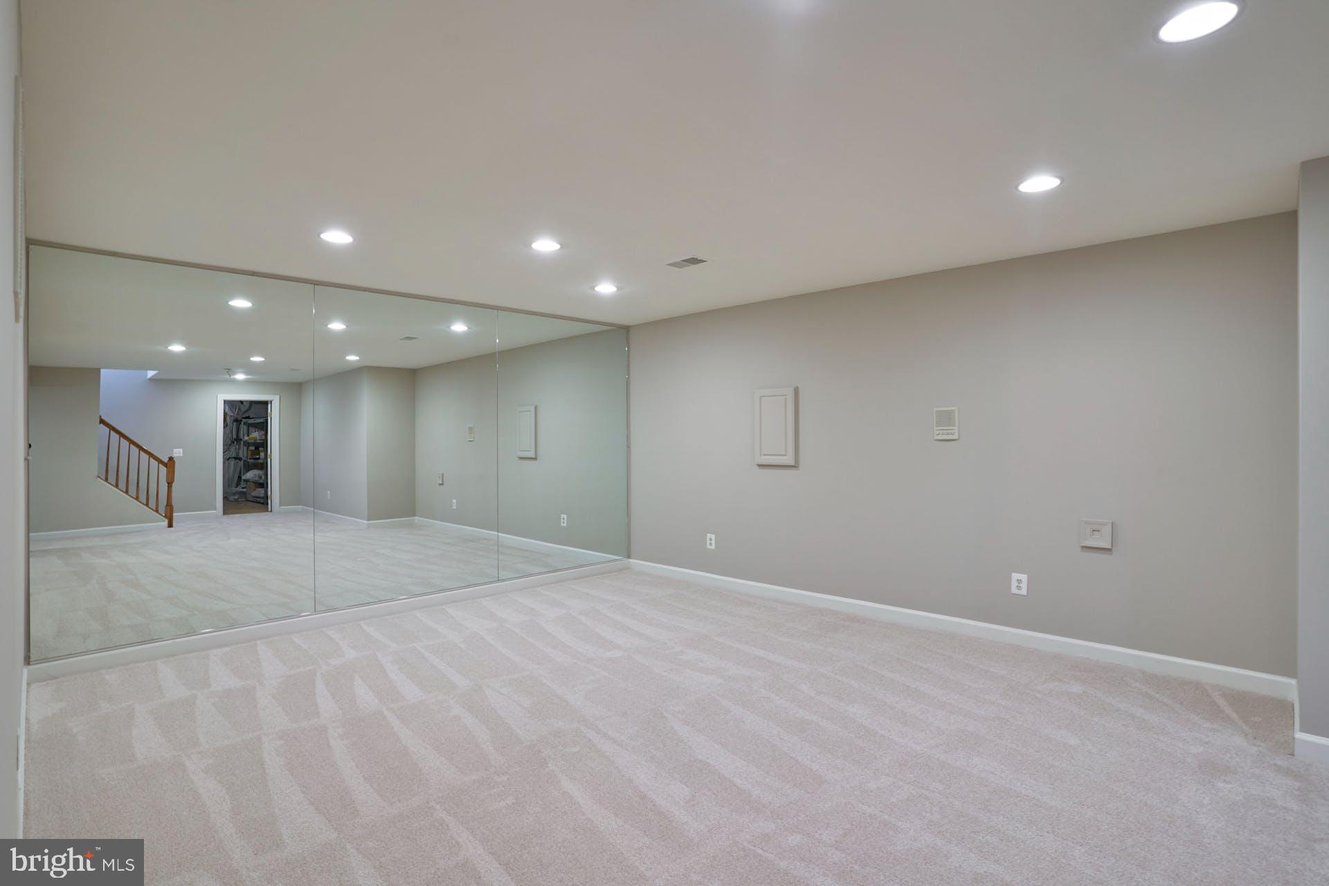 14241 Clubhouse Road Gainesville, VA 20155 - Photo 41 of 62 Exercise/yoga area with built-in wall mirror