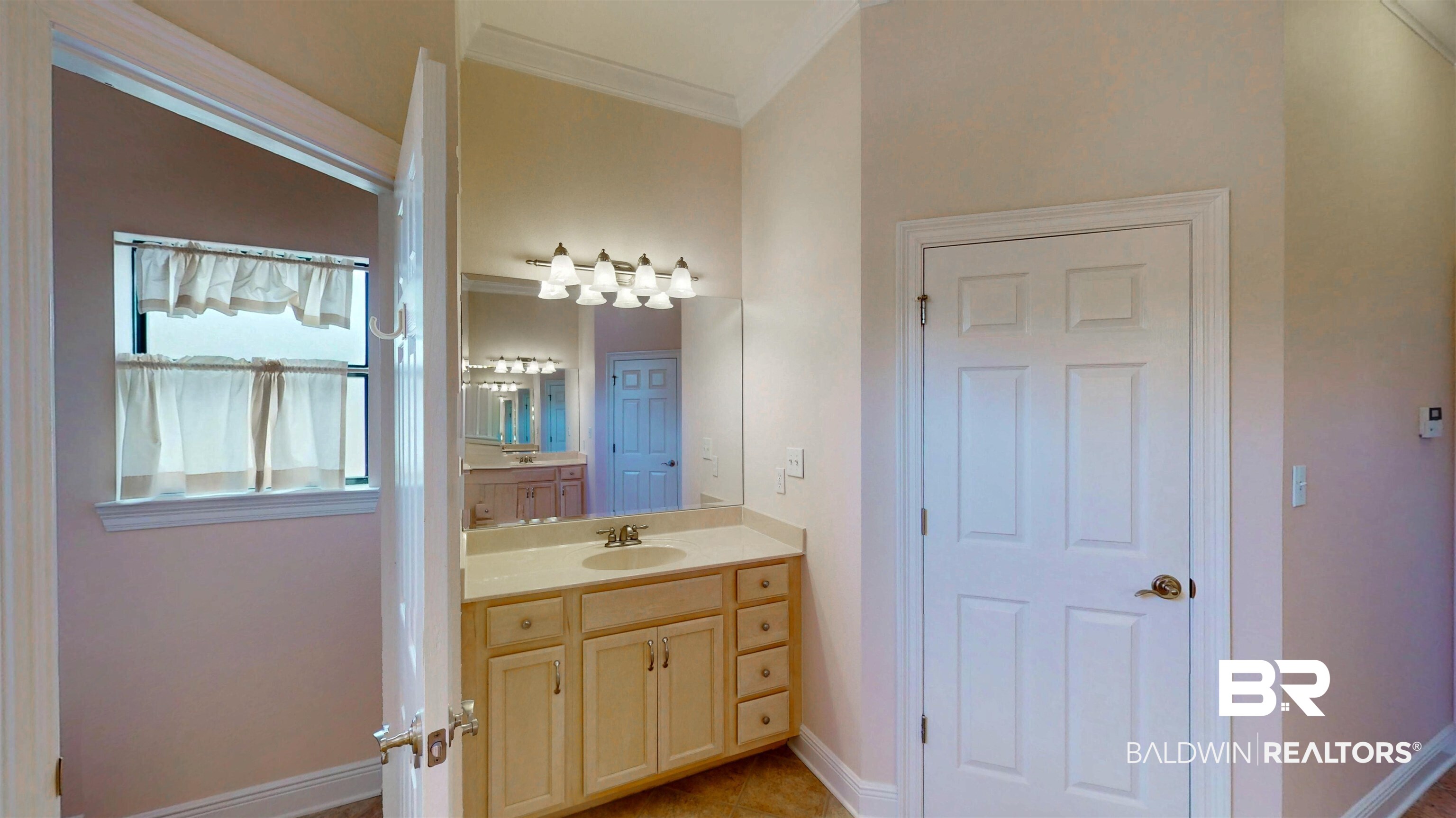 214 Hemingway Loop Foley, AL 36535 - Photo 29 of 67 Bathroom featuring vanity, light tile patterned floors, and ornamental molding