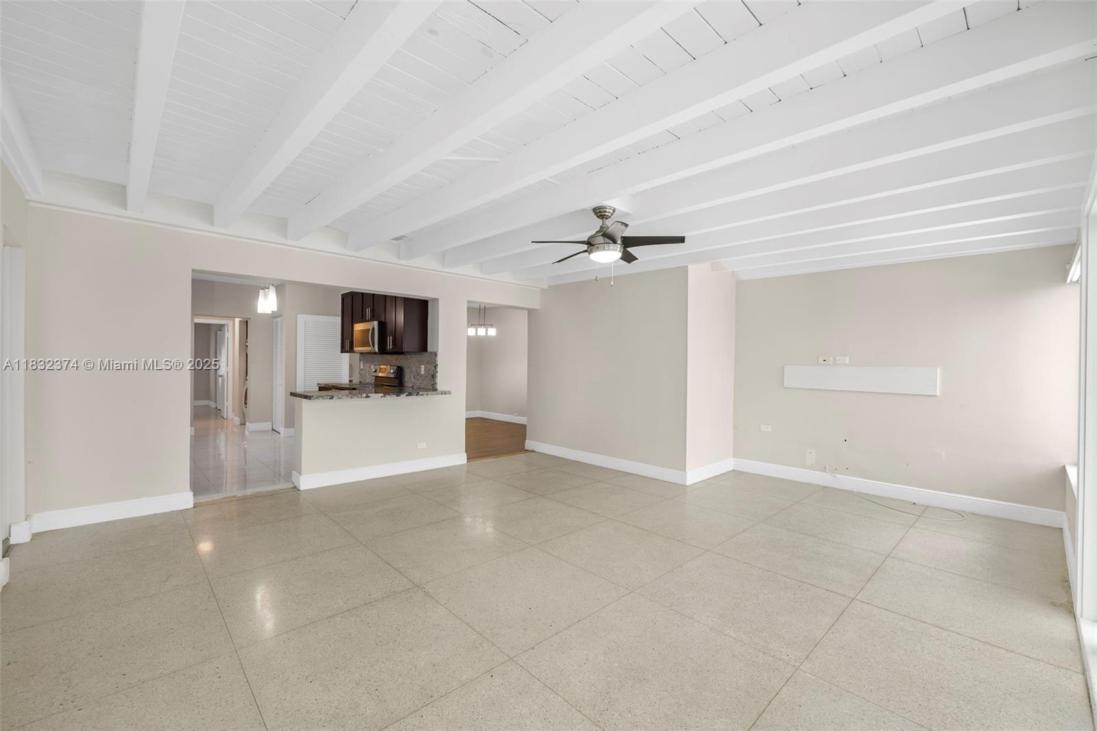 340 Southwest 25th Road Miami, FL 33129 - Photo 16 of 42 a view of a kitchen with a sink and cabinet area an empty room