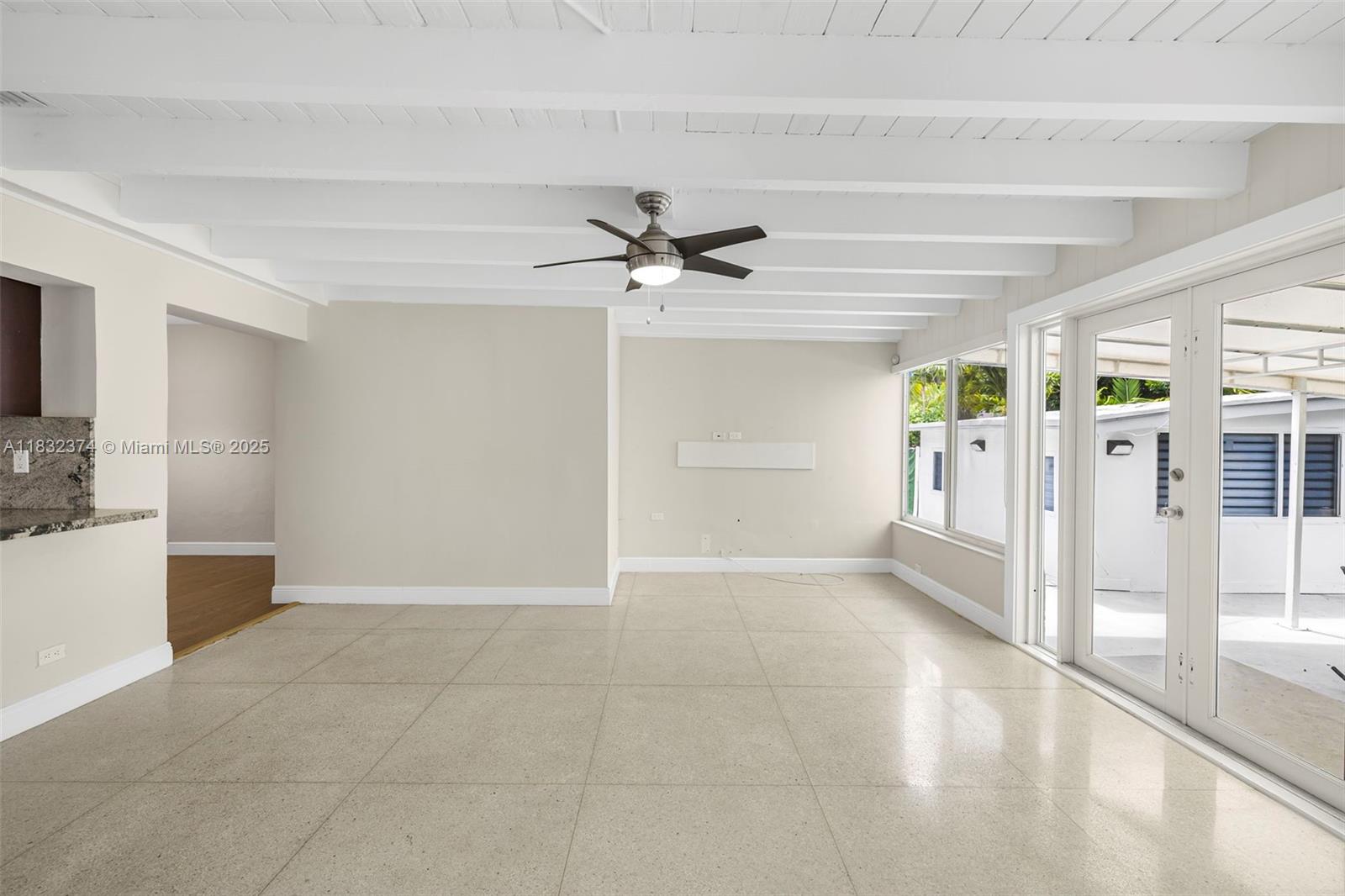 340 Southwest 25th Road Miami, FL 33129 - Photo 18 of 42 a view of an empty room with a window