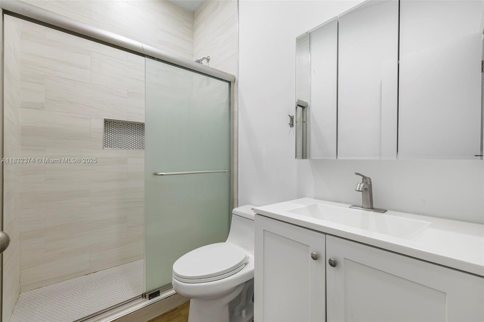 340 Southwest 25th Road Miami, FL 33129 - Photo 21 of 42 a bathroom with a sink toilet and shower