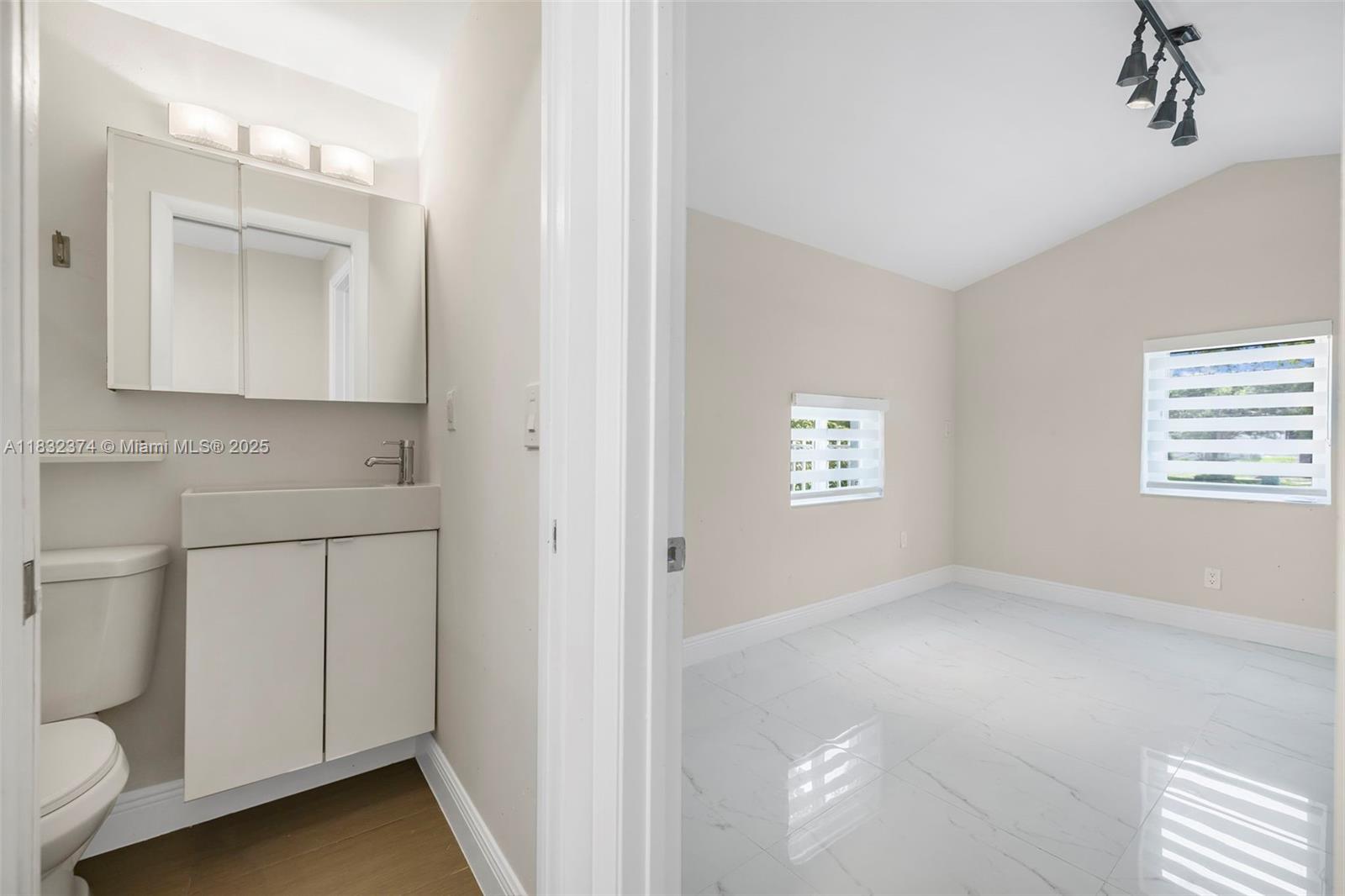 340 Southwest 25th Road Miami, FL 33129 - Photo 28 of 42 a view of a utility room with closet and mirror