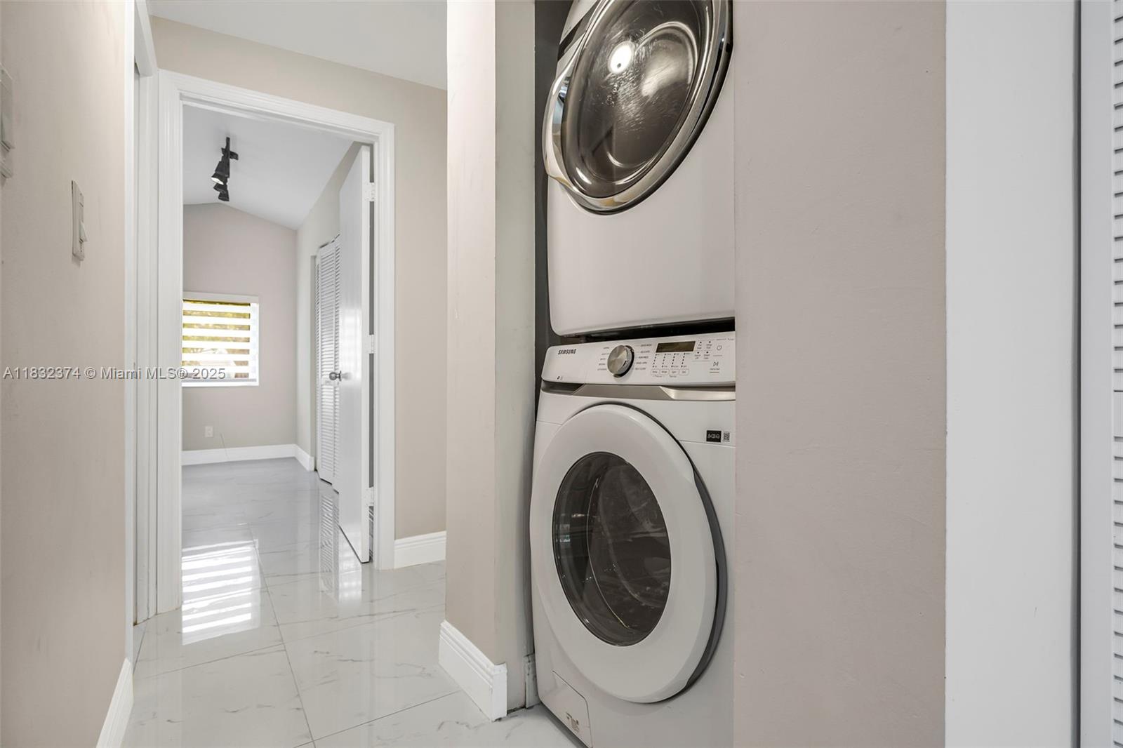 340 Southwest 25th Road Miami, FL 33129 - Photo 29 of 42 a view of a hallway with washer and dryer