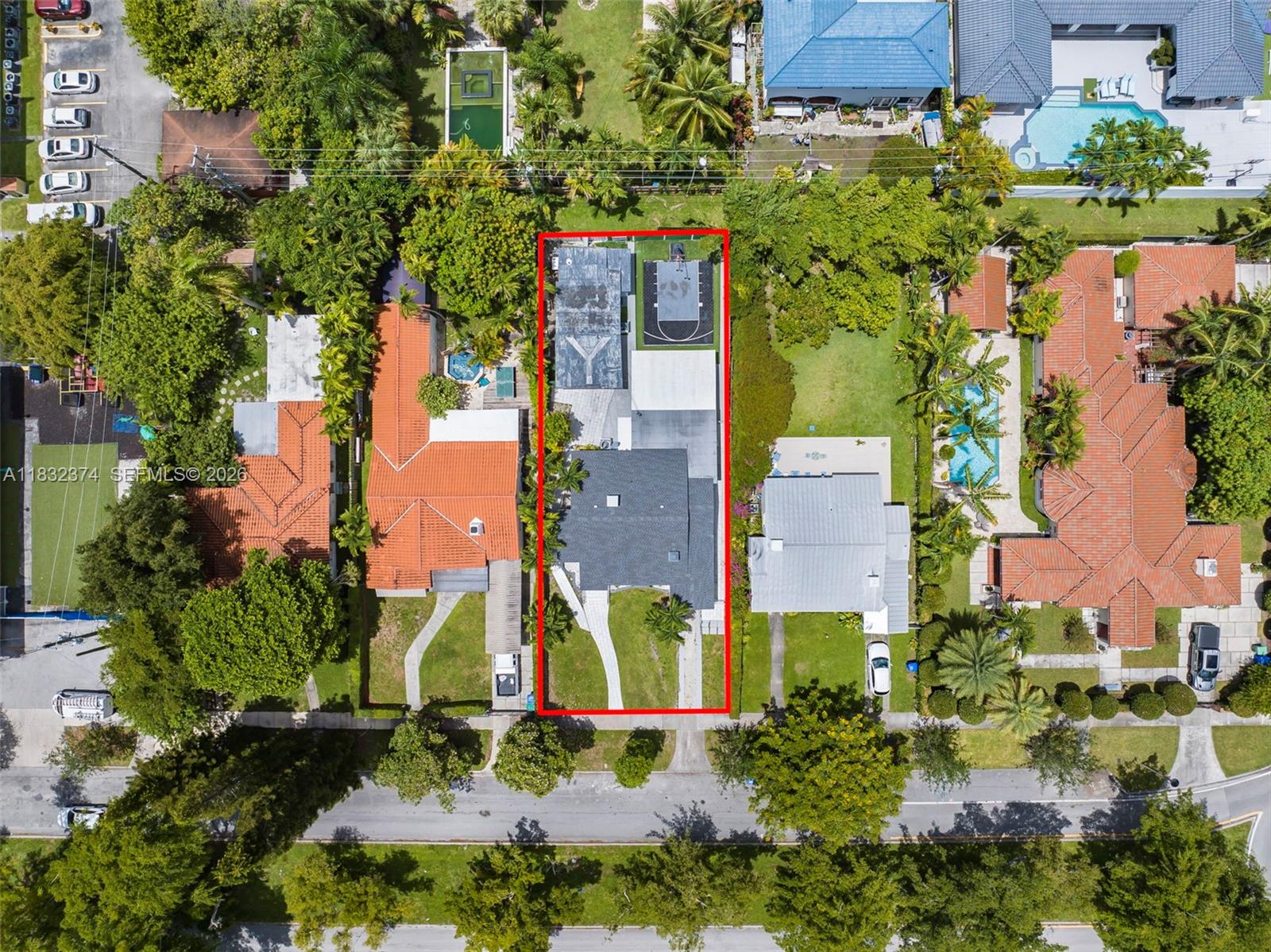 340 Southwest 25th Road Miami, FL 33129 - Photo 3 of 3 an aerial view of a house with a yard and large trees