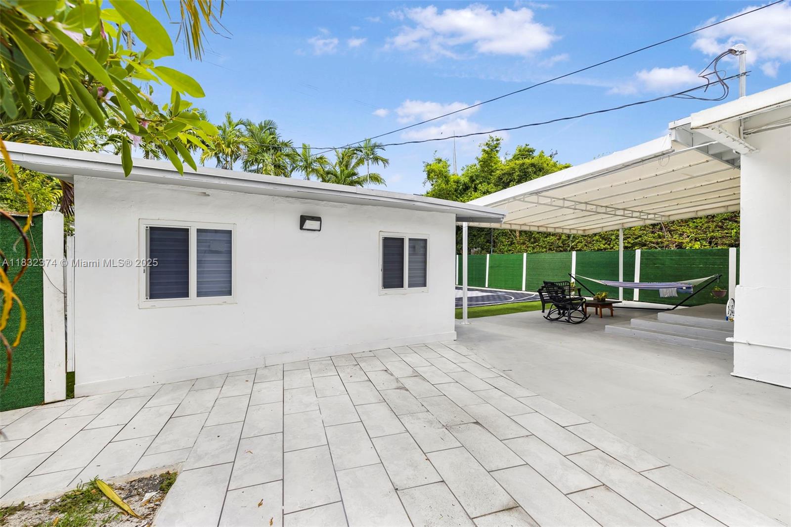 340 Southwest 25th Road Miami, FL 33129 - Photo 32 of 42 a view of a house with a backyard
