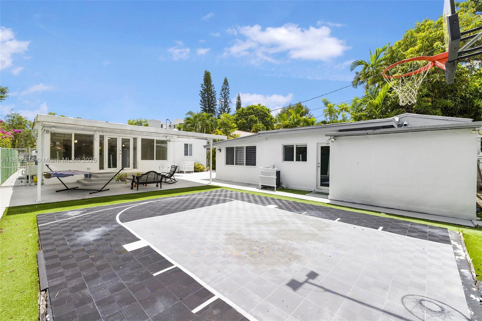 340 Southwest 25th Road Miami, FL 33129 - Photo 34 of 42 a view of a house with a swimming pool and sitting area