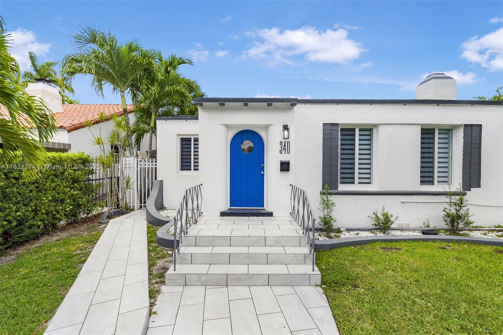 340 Southwest 25th Road Miami, FL 33129 - Photo 5 of 42 a front view of a house with garden