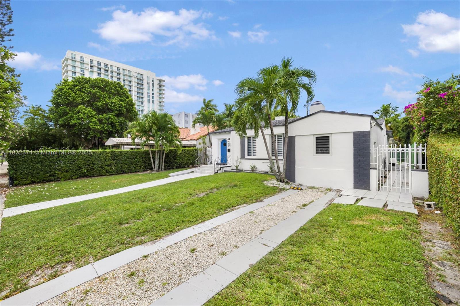 340 Southwest 25th Road Miami, FL 33129 - Photo 6 of 42 a front view of a house with garden