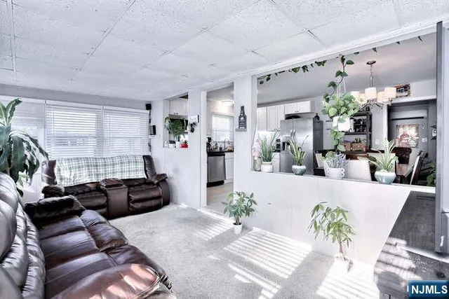 a living room with furniture windows and a fireplace