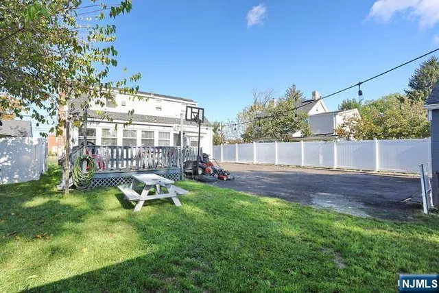 a view of a chair and table in the backyard