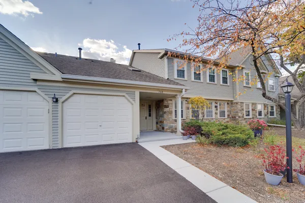 a front view of a house with a garage