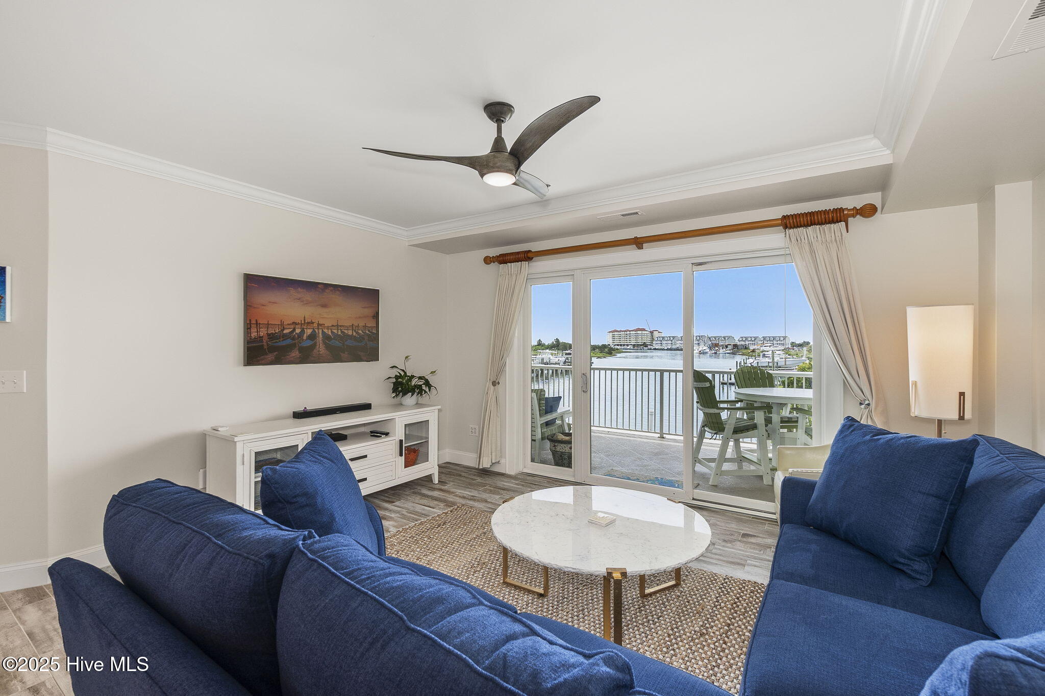 212 Old Causeway Road, Unit 107 & B13 SLIP Beaufort, NC 28516 - Photo 3 of 50 Living room with covered balcony access
