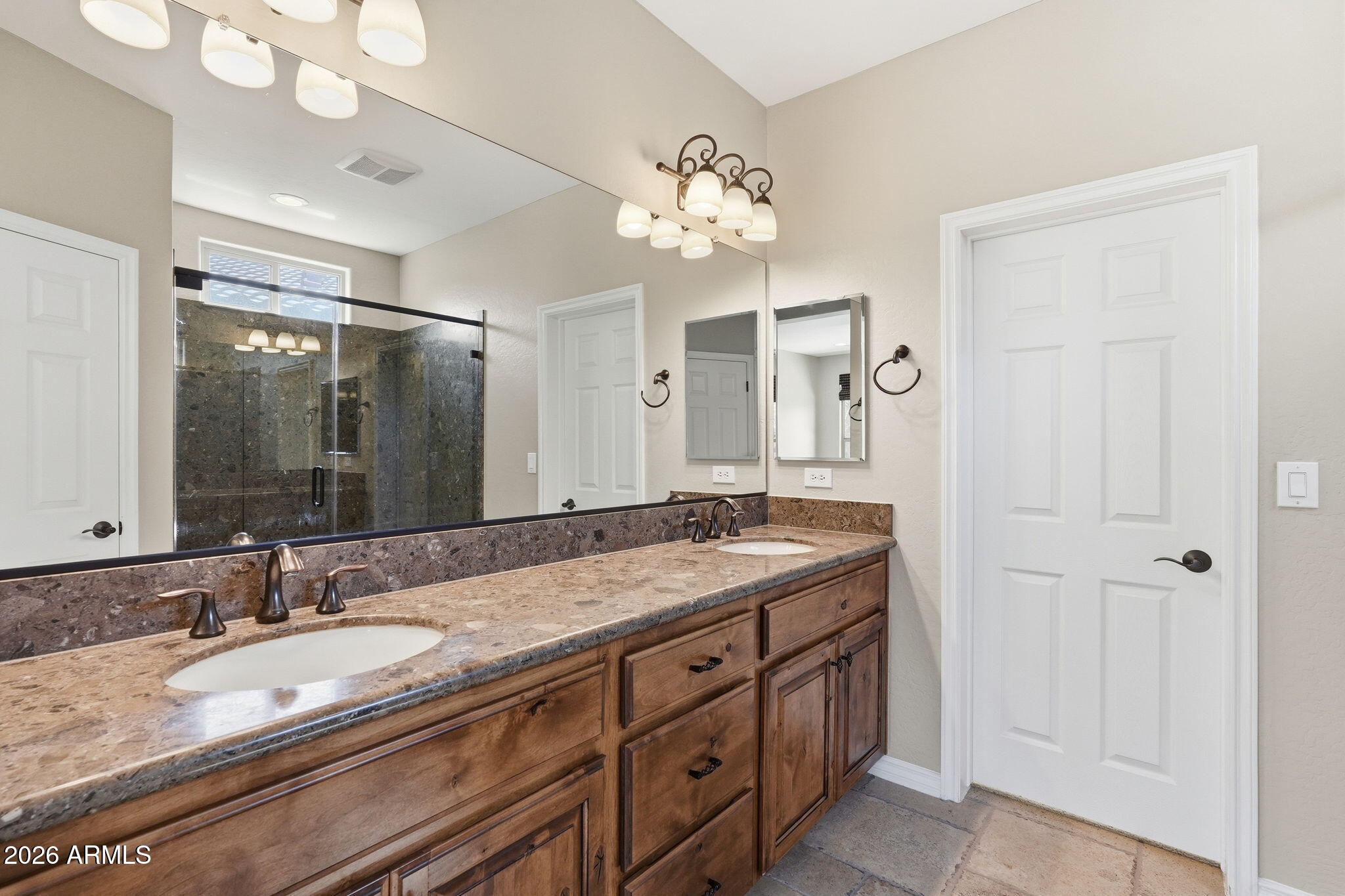 1694 East Grand Ridge Road Queen Creek, AZ 85140 - Photo 29 of 61 a bathroom with a granite countertop double vanity sink and a mirror