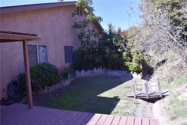a view of a backyard of the house