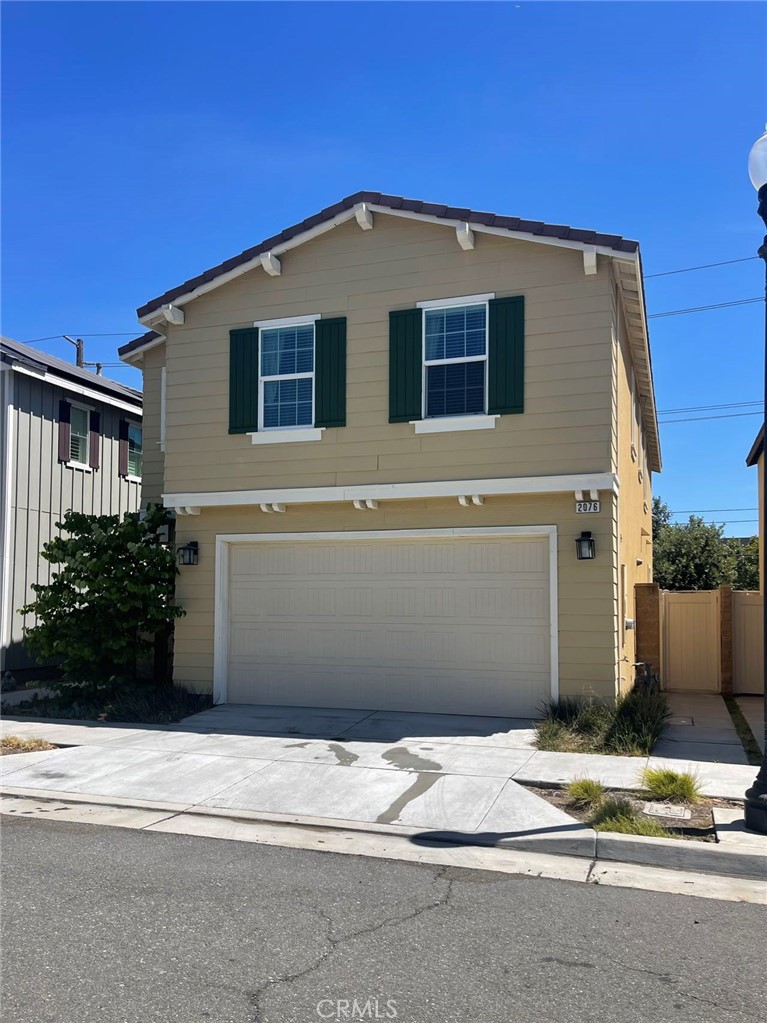 2076 East Bulletin Privado Ontario, CA 91764 - Photo 1 of 20 a front view of a house