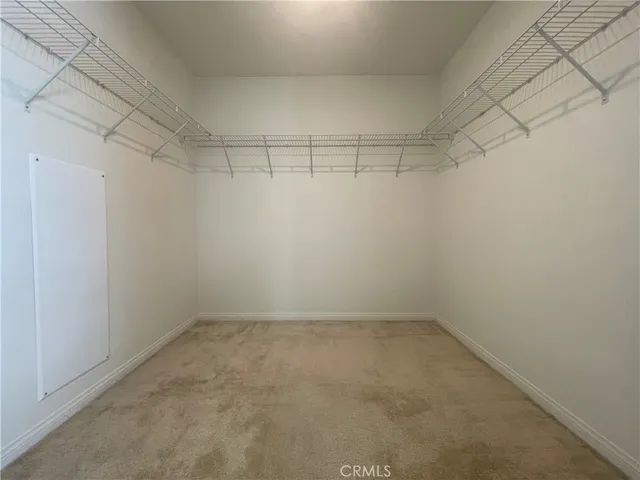 an empty room with a empty space and windows