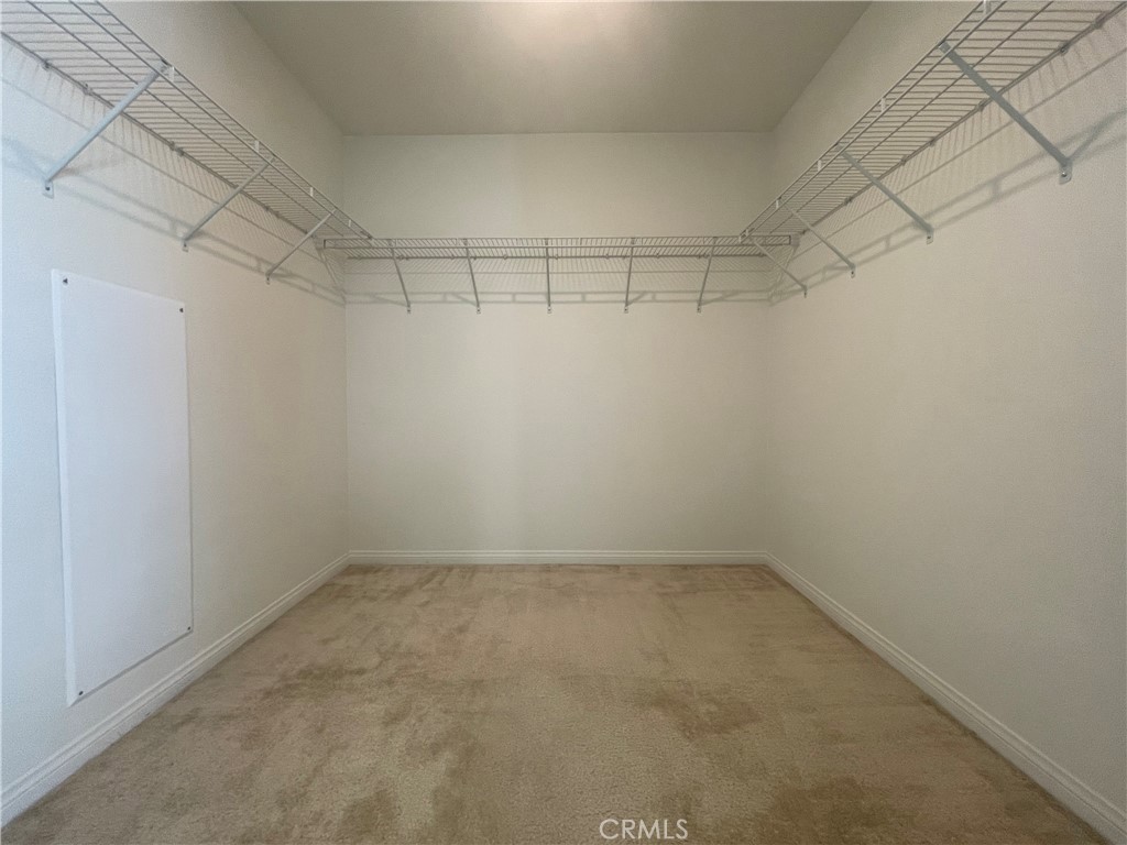 2076 East Bulletin Privado Ontario, CA 91764 - Photo 14 of 20 a view of a room with racks on the wall