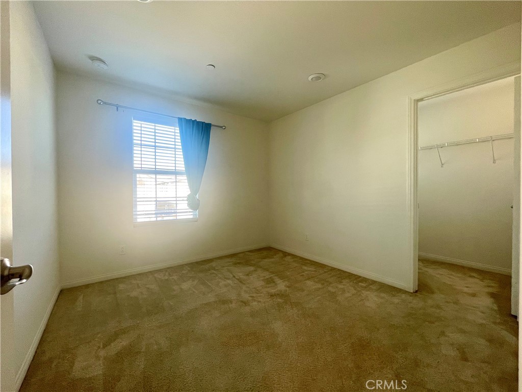 2076 East Bulletin Privado Ontario, CA 91764 - Photo 16 of 20 an empty room with a empty space and windows