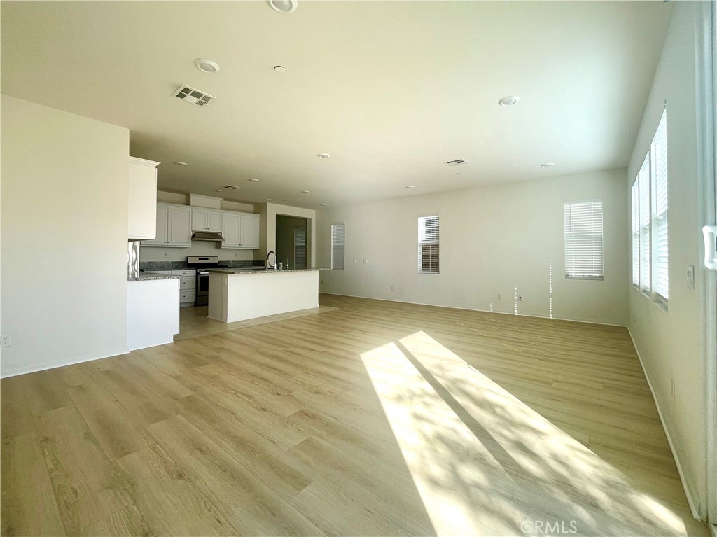 2076 East Bulletin Privado Ontario, CA 91764 - Photo 7 of 20 a view of a kitchen with microwave and cabinets