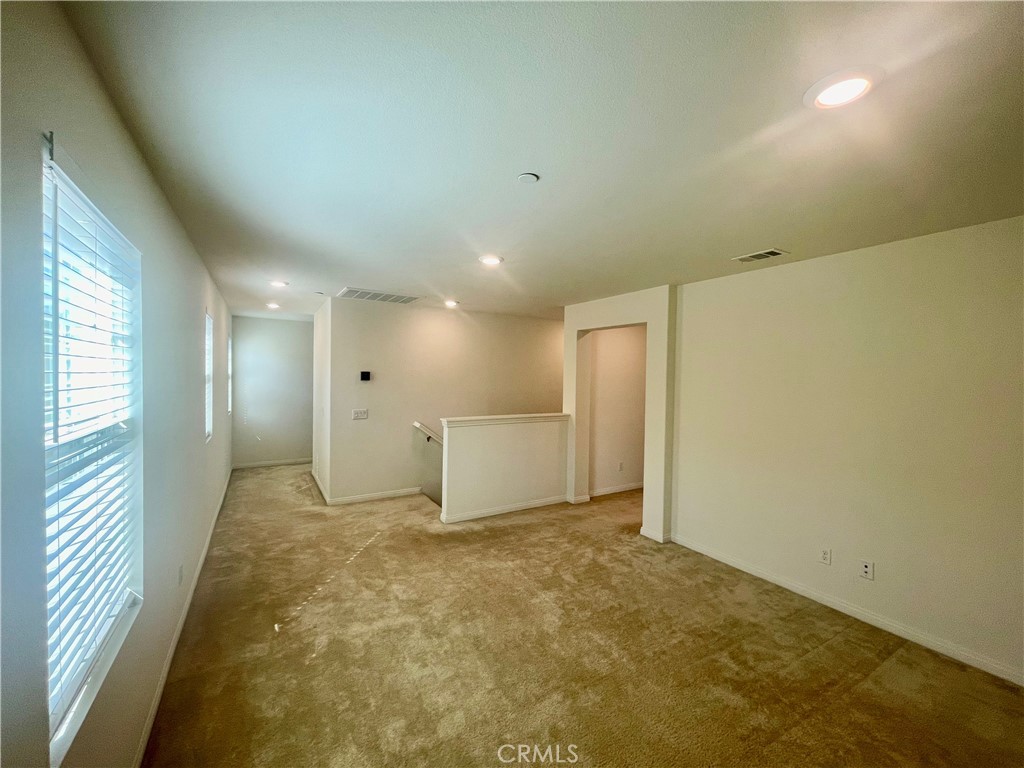 2076 East Bulletin Privado Ontario, CA 91764 - Photo 10 of 20 a view of a big room with a chandelier fan and windows
