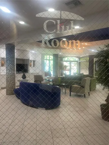 a large room with lots of furniture and a large window