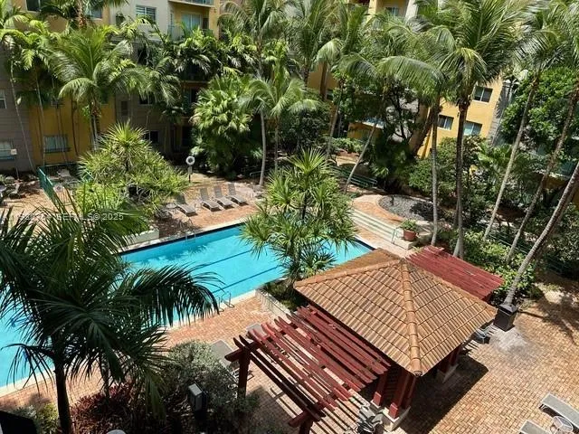 a view of a backyard with sitting area