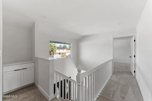 a view of a hallway with a window