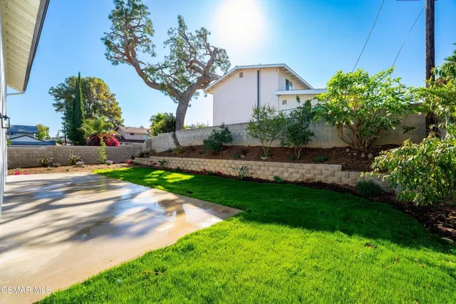 a view of a back yard of the house