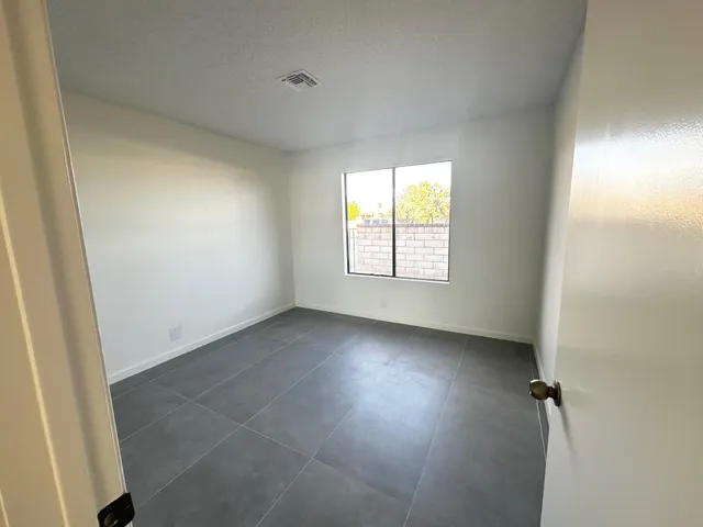 an empty room with windows