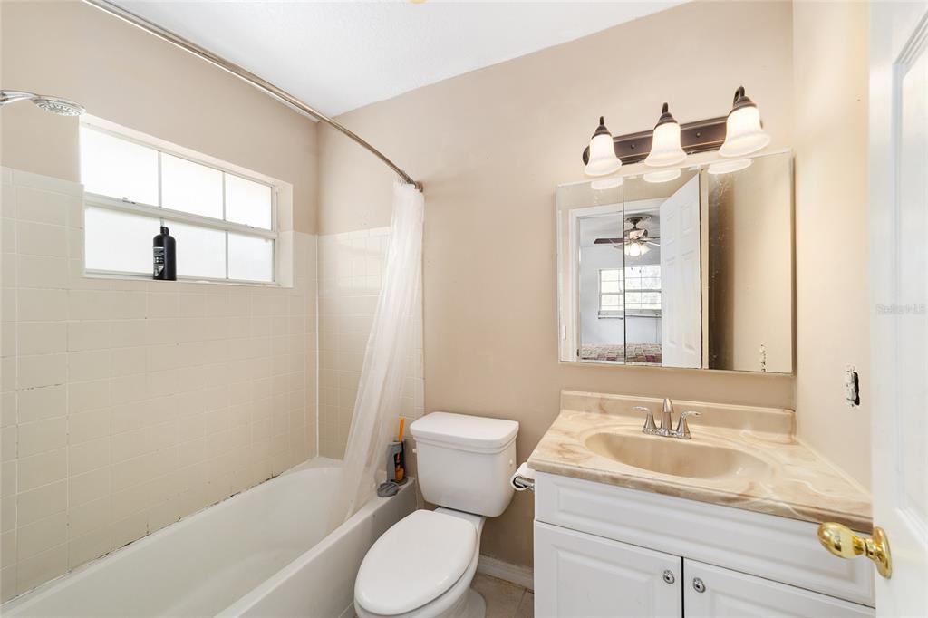 20934 3rd Avenue Dunnellon, FL 34431 - Photo 16 of 33 a bathroom with a sink toilet and shower