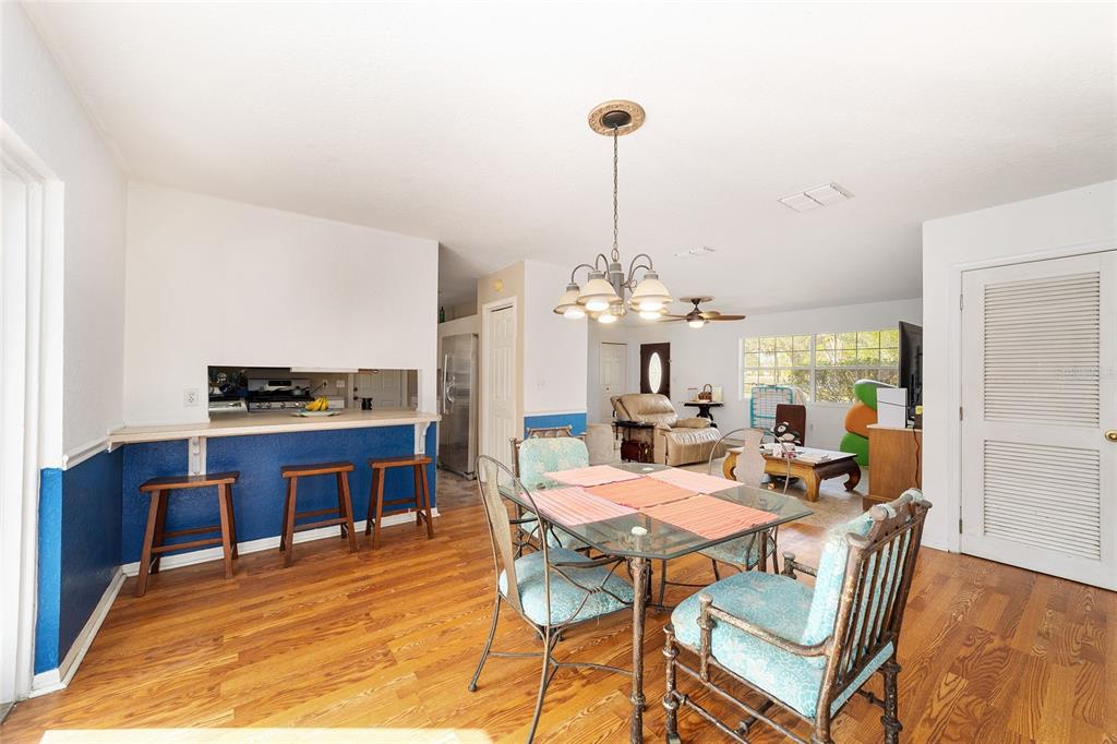 20934 3rd Avenue Dunnellon, FL 34431 - Photo 10 of 33 a view of a dining room with furniture window and wooden floor