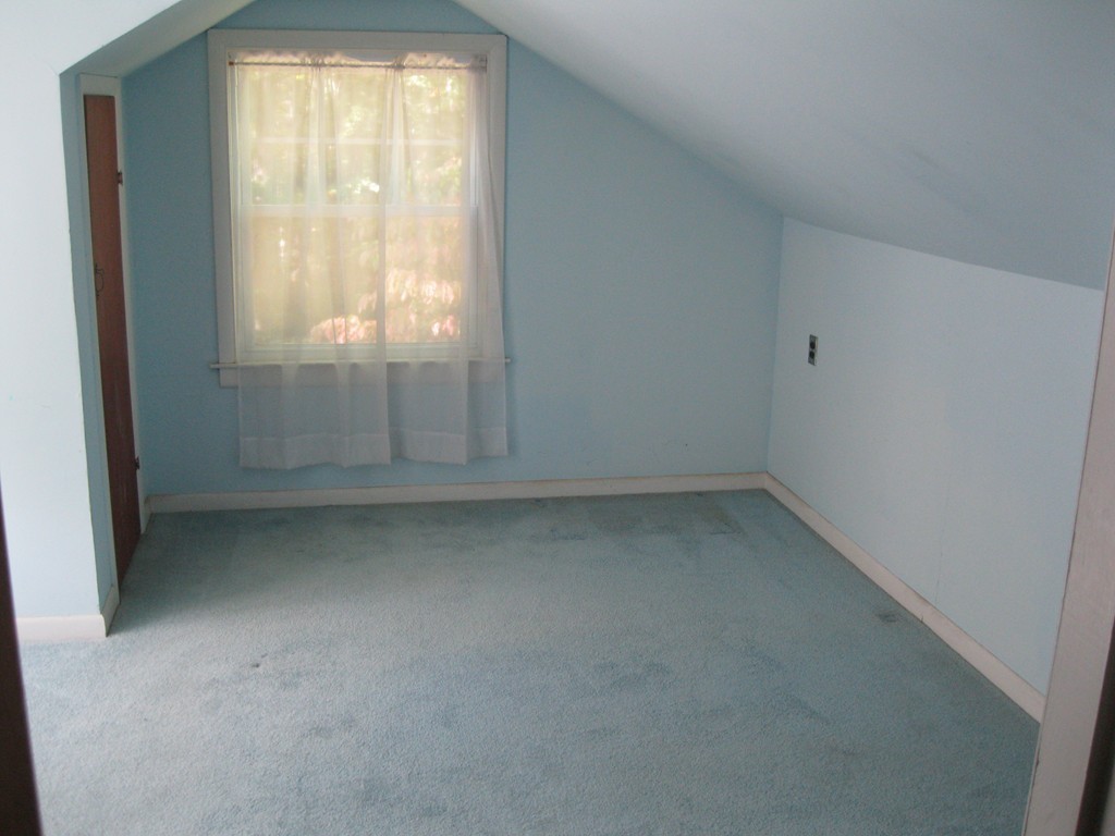 232 Gates Pond Road Berlin, MA 01503 - Photo 18 of 25 an empty room with a window