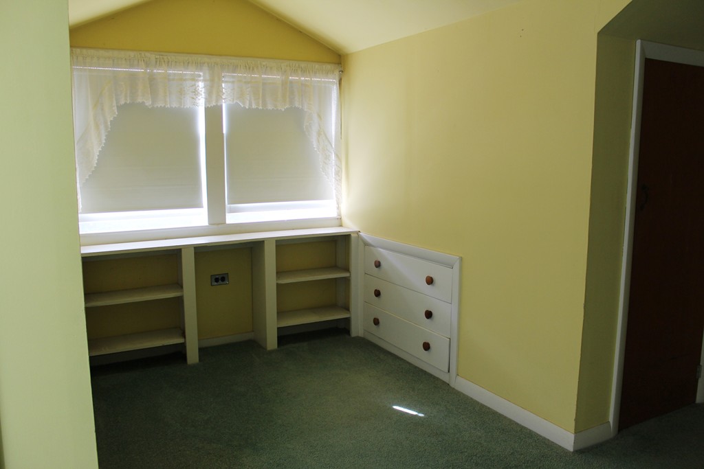 232 Gates Pond Road Berlin, MA 01503 - Photo 21 of 25 a room with cabinets and a window