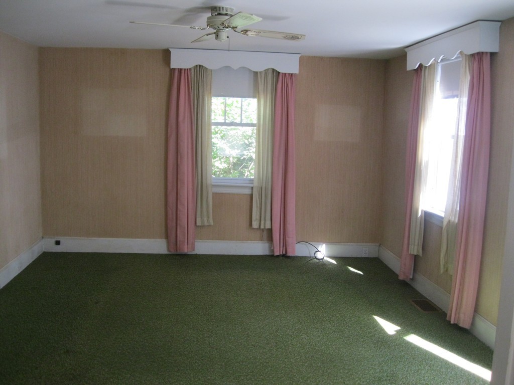 232 Gates Pond Road Berlin, MA 01503 - Photo 9 of 25 an empty room with windows