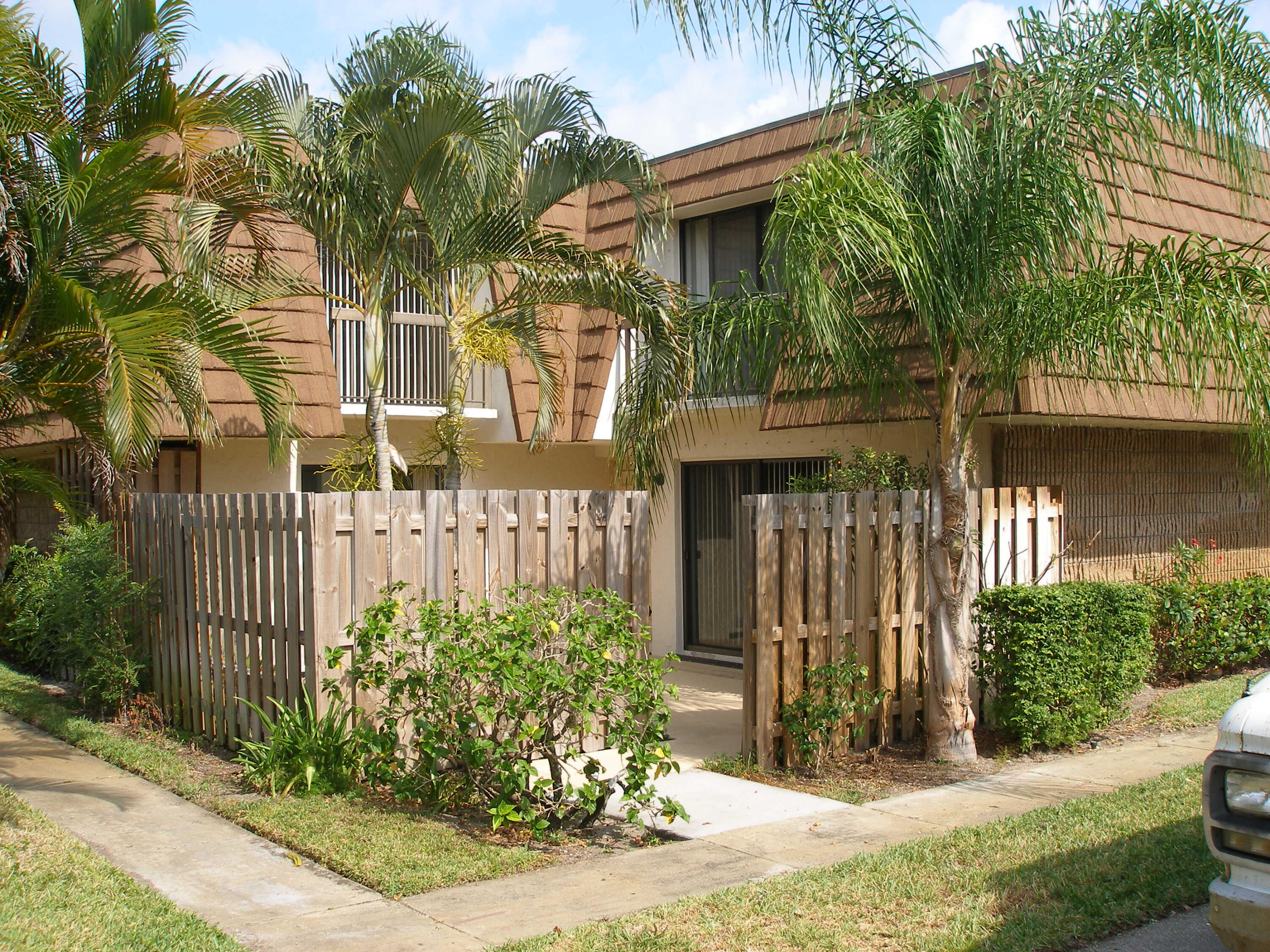 825 Center Street, Unit 7C Jupiter, FL 33458 - Photo 1 of 28 view front of townhome