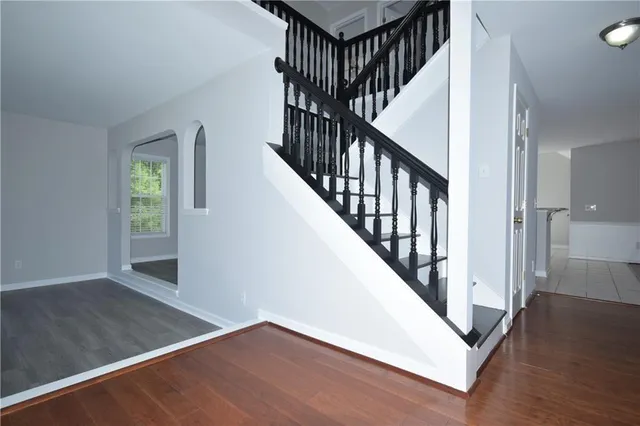 a view of an entryway with wooden floor