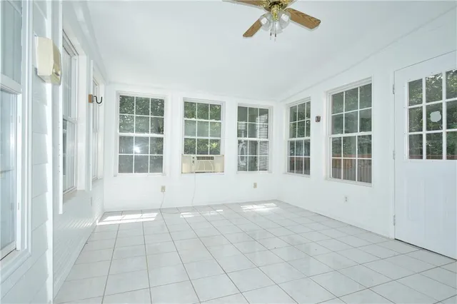 a view of an empty room with a window