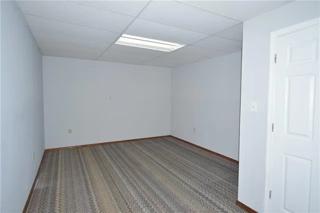 a view of room with wooden floor